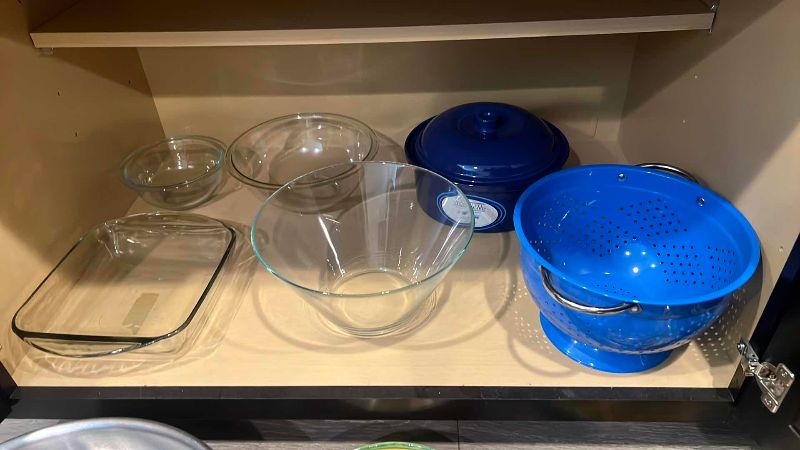 Photo 1 of CONTENTS OF CABINET LARGE MIXING BOWLS, CERAMICS, STRAINERS AND  BAKE WARE
