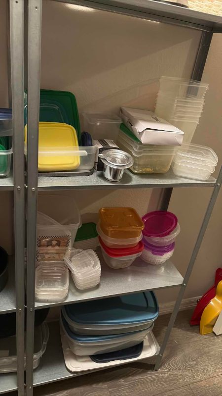 Photo 1 of SHELVES OF PLASTIC TUPPERWARE SHELVING INCLUDED 48” X 11” X 56” H