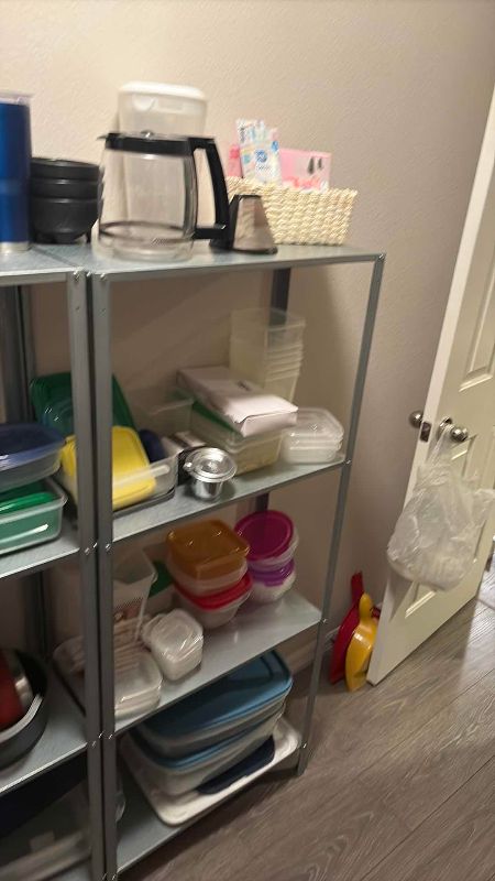 Photo 1 of SHELVES OF PLASTIC TUPPERWARE SHELVING INCLUDED 48” X 11” X 56” H