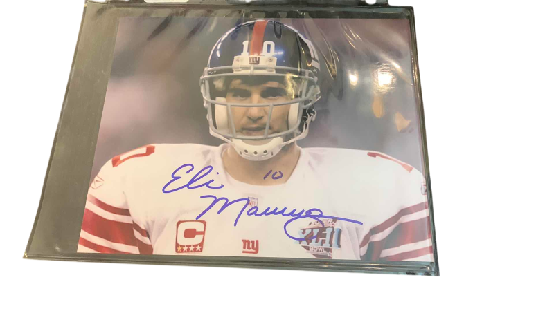 Photo 1 of ELI MANNING AUTOGRAPHED 8 X 10 AUTHENTICATED PHOTO