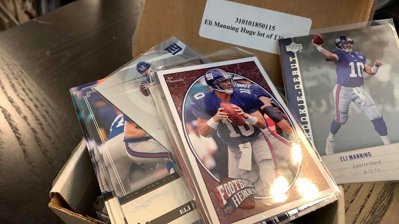 Photo 1 of LOT OF ELI MANNING CARDS