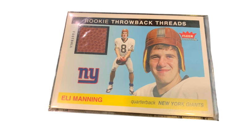 Photo 1 of 2004 FLEER ELI MANNING ROOKIE PREMIERE USED FOOTBALL CARD