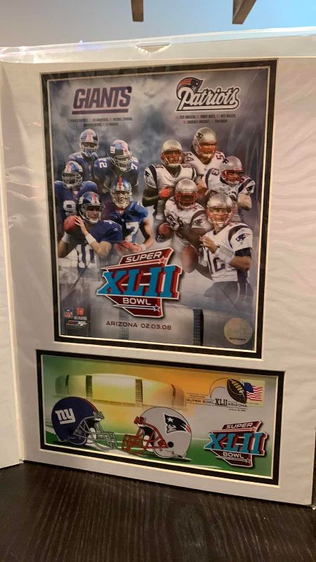 Photo 1 of 2- 8 X 10 ELI MANNING NFL AUTHENTICATED PICTURES WITH FIRST DAY ISSUE STAMPS