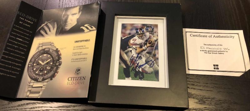 Photo 1 of ELI MANNING 4" X 6"  AUTHENTICATED AUTOGRAPHED PICTURE AND WATCH AD