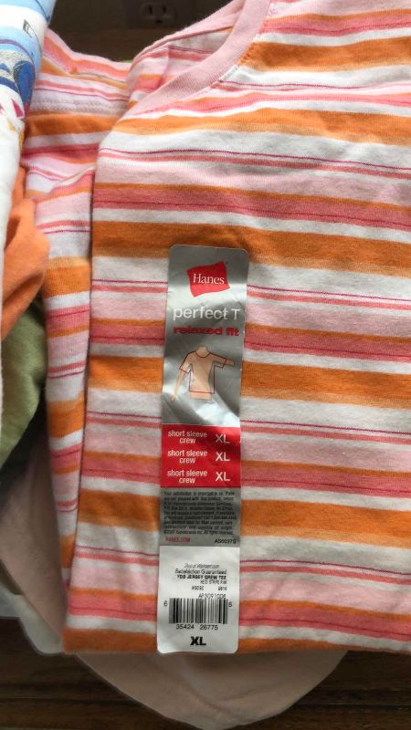 Photo 1 of WOMENS CASUAL SHIRTS SIZE L AND XL