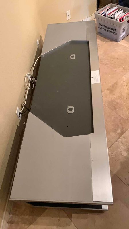 Photo 1 of METAL AND GLASS TELEVISION STAND 74” X 22” H 15”