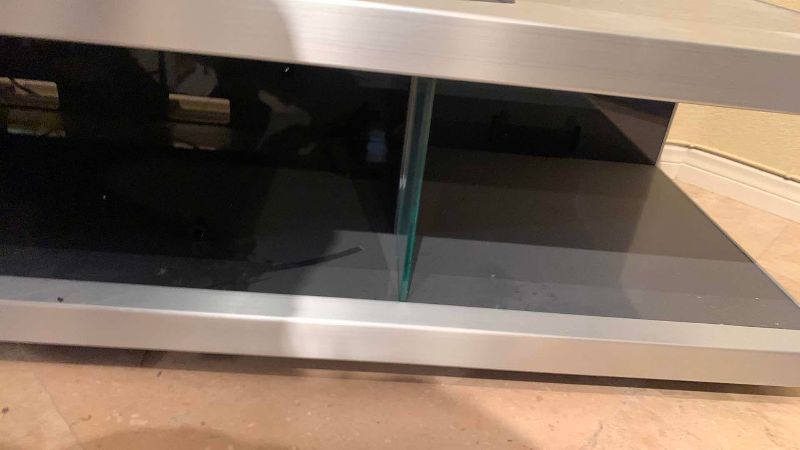 Photo 1 of METAL AND GLASS TELEVISION STAND 74” X 22” H 15”