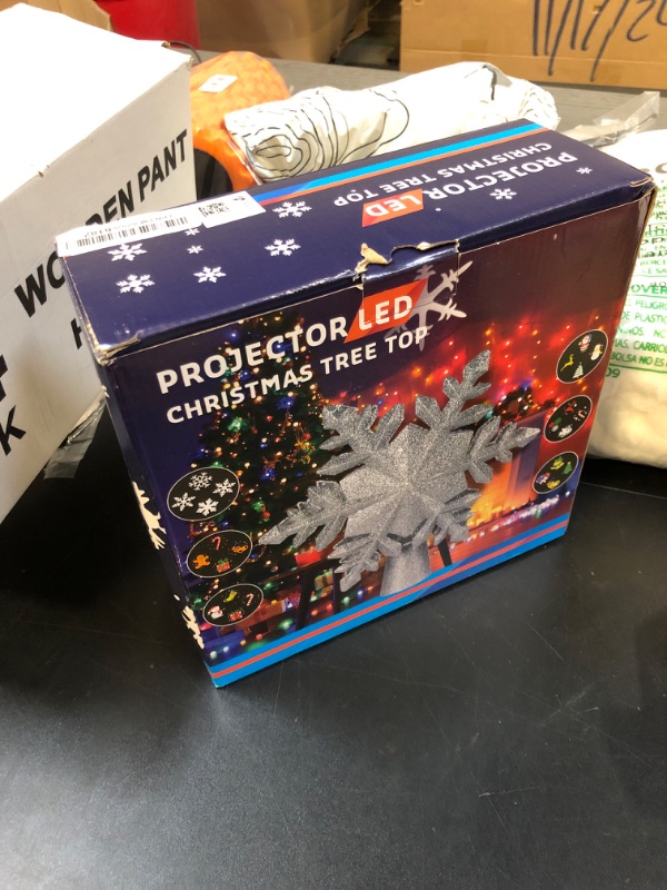 Photo 1 of DG-Direct Christmas Tree Topper Lighted with 6 Projected Patterns, Led Rotating Magic Snowflake, 3D Hollow Glitter Lighted Silver Snow Tree Topper for Christmas Tree Decorations, Silver
