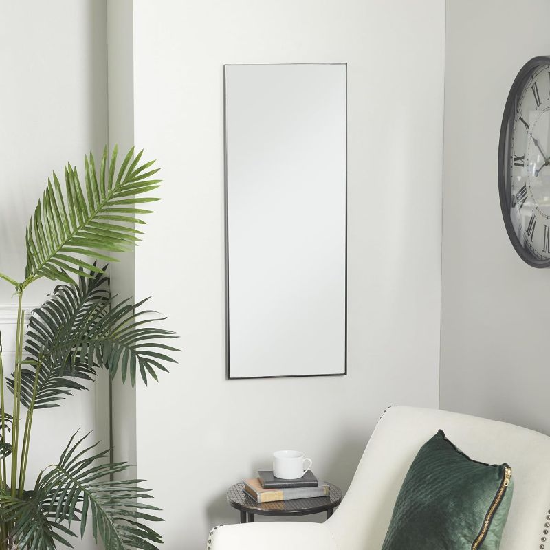 Photo 1 of Deco 79 Wood Room Wall Mirror Entryway Mirror with Thin Minimalistic Frame, Wall Mounted Mirror 14" x 1" x 30", Black https://a.co/d/cSFy2eo