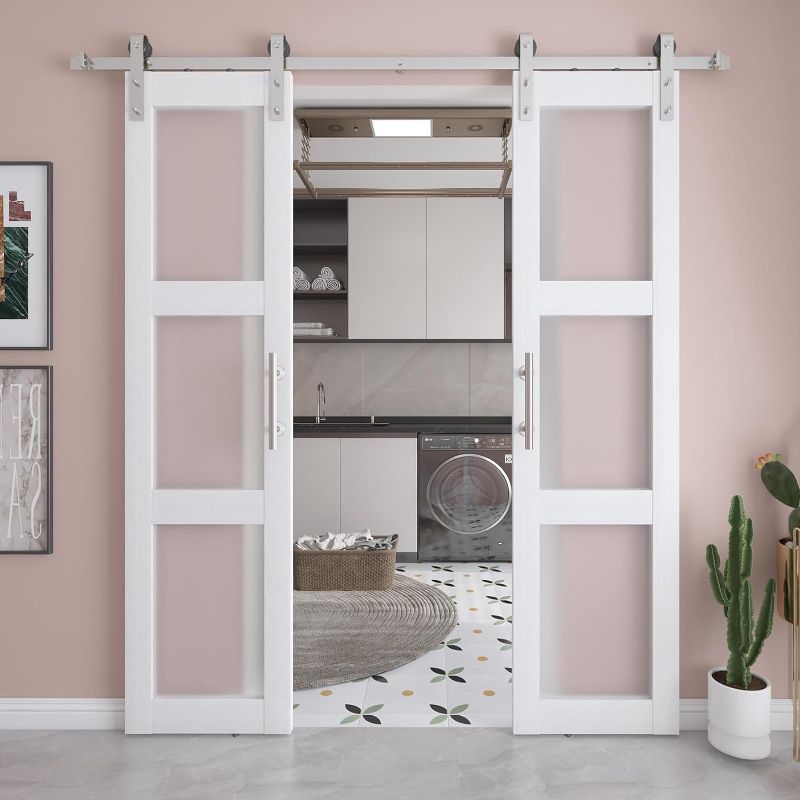 Photo 1 of ***SEE NOTES***
barnsmith 21x84in double glass barn  door with 7ft brushed nickle sliding door hardware kit included & handle , 3 panel frosted glass solid wood water proof pvc surface, pre-drilled easy assemble, (white)