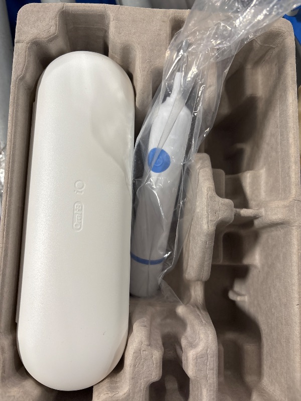 Photo 1 of Oral-B iO Deep Clean + Whiten Rechargeable Electric Toothbrush with Visible Pressure Sensor, 2 Minute Timer, 5 Cleaning Settings, 1 iO5 Limited, 3 Toothbrush Heads, Travel Case & Refill Holder, White
