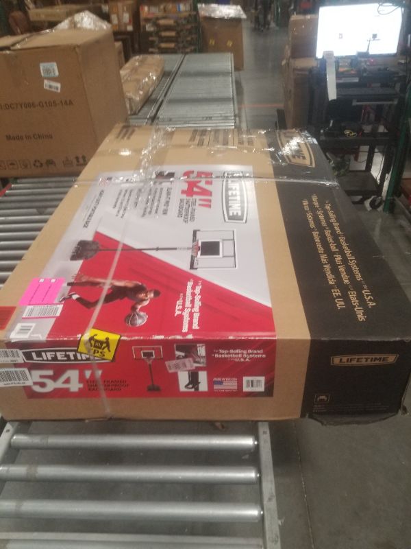 Photo 1 of Lifetime Adjustable Portable Basketball Hoop, 54-Inch Steel-Framed Polycarbonate Backboard