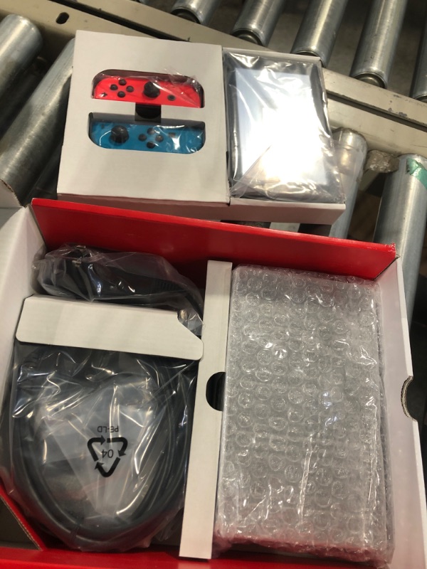 Photo 6 of ****LIKE NEW, HAS BEEN OPENED**** Nintendo Switch™ with Neon Blue and Neon Red Joy?Con™