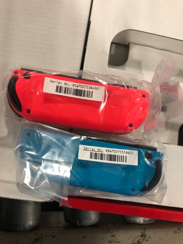 Photo 5 of ****LIKE NEW, HAS BEEN OPENED**** Nintendo Switch™ with Neon Blue and Neon Red Joy?Con™