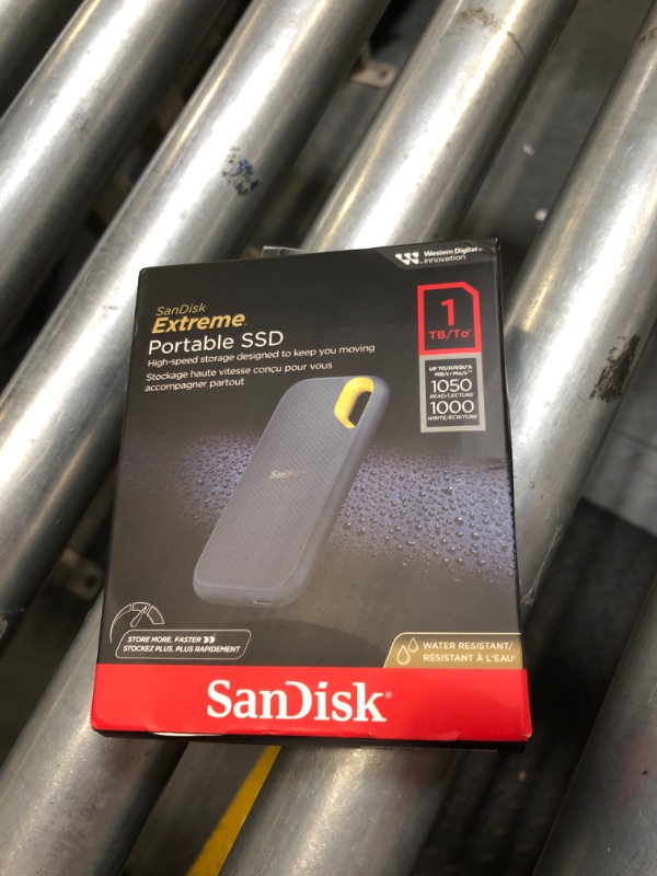 Photo 1 of SanDisk 1TB Extreme Portable SSD - Up to 1050MB/s, USB-C, USB 3.2 Gen 2, IP65 Water and dust Resistance, Updated Firmware, Monterey - External Solid State Drive - SDSSDE61-1T00-G25M