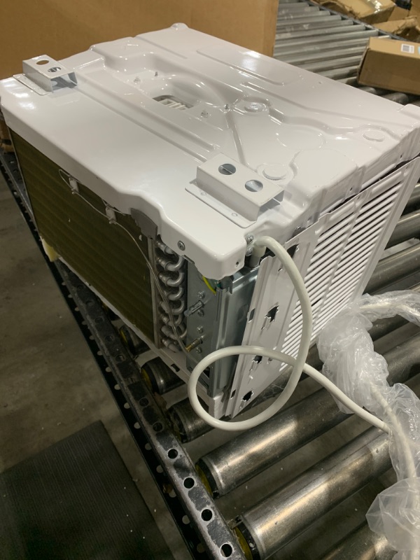 Photo 1 of Amazon Basics Window-Mounted Air Conditioner with Mechanical Control - Cools 150 Square Feet, 5000 BTU, AC Unit PARTS ONLY