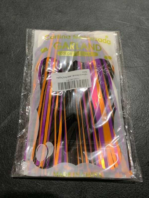 Photo 1 of Halloween Decorations Foil Fringe Garland Tinsel Streamers 2 Packs 20 Ft,Orange Purple Black Pumpkin Hanging Backdrop Banner Table Skirts for Halloween Party Supplies
