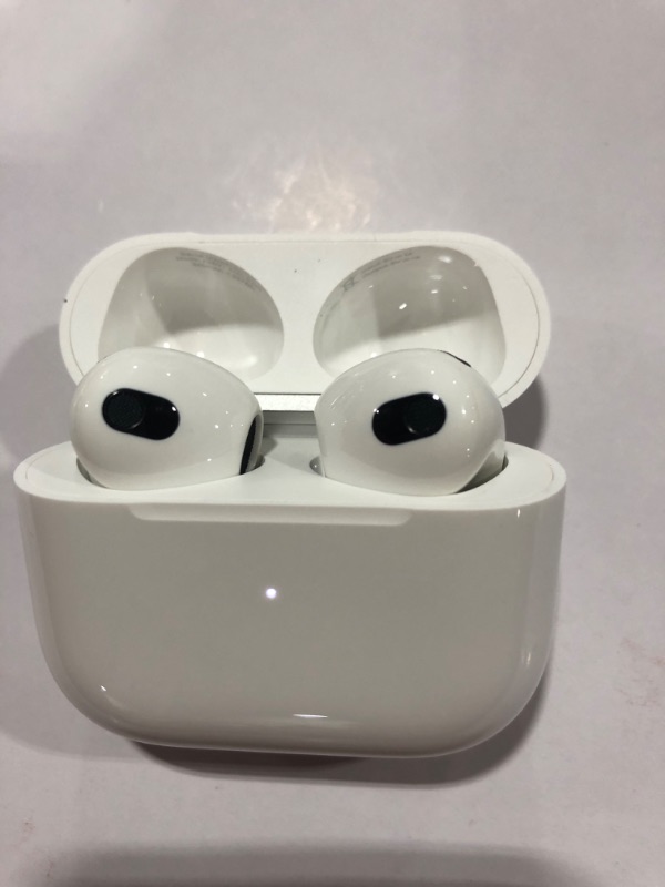 Photo 4 of Apple AirPods (3rd Generation) Wireless Ear Buds, Bluetooth Headphones, Personalized Spatial Audio, Sweat and Water Resistant, Lightning Charging Case Included, Up to 30 Hours of Battery Life
