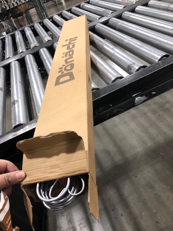 Photo 1 of Portable Foldable Pet Gate for Front Doors Durable Retractable Dog Fence with Easy Setup for Puppy Training Enhancing Home Safety and Security with Bone Style Design- Silver