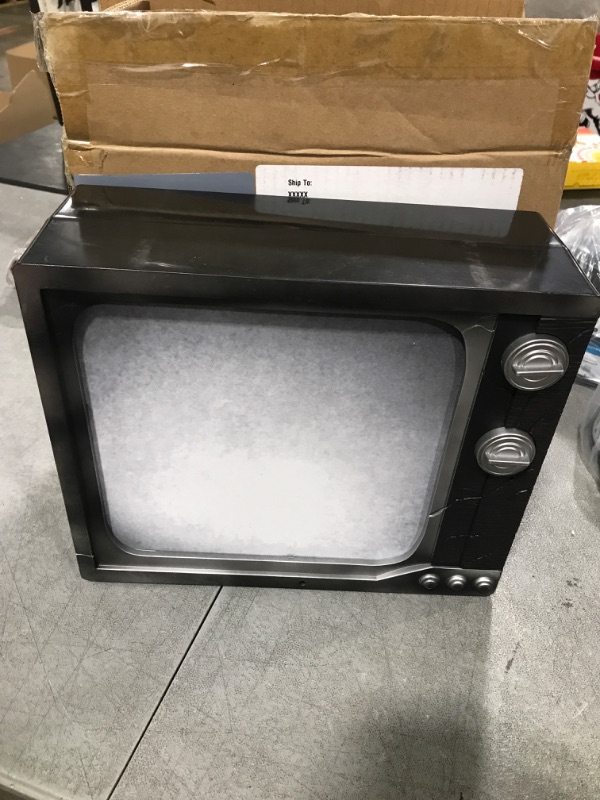 Photo 1 of Haunted Hill Farm Haunted TV by Tekky, Battery-Operated, Motion Activated Animatronic Television with Sound Effects and Lights for Indoor or Covered Outdoor Creepy Halloween Decoration