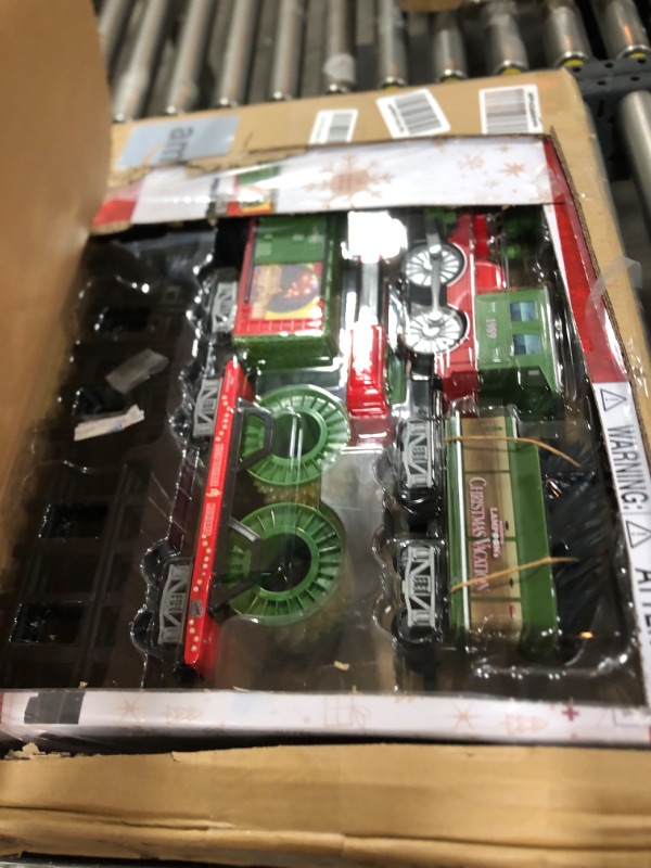 Photo 1 of Lionel Battery-Operated Elf Toy Train Set with Locomotive, Train Cars, Track & Remote with Authentic Train Sounds, & Lights for Kids 4+