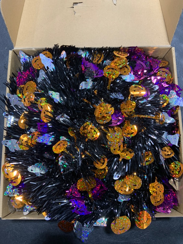 Photo 2 of Caplidou 5 FT Black Tinsel Halloween Tree, Pop Up Halloween Christmas Tree Artificial Collapsible Halloween Pencil Trees with 60 LED Orange and Purple Lights for Party Door Porch Home Decorations