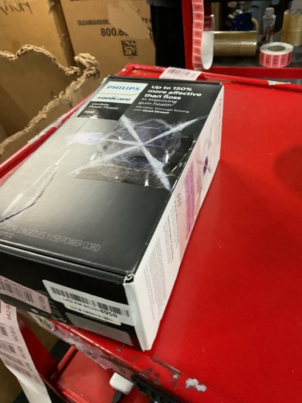 Photo 1 of Philips Sonicare Cordless Power Flosser 3000, Water Flosser with Innovative Quad Stream Technology, Oral Irrigator with 2 Flossing Modes and 3 Intensity Levels, Ergonomic Design, Black, HX3826/23