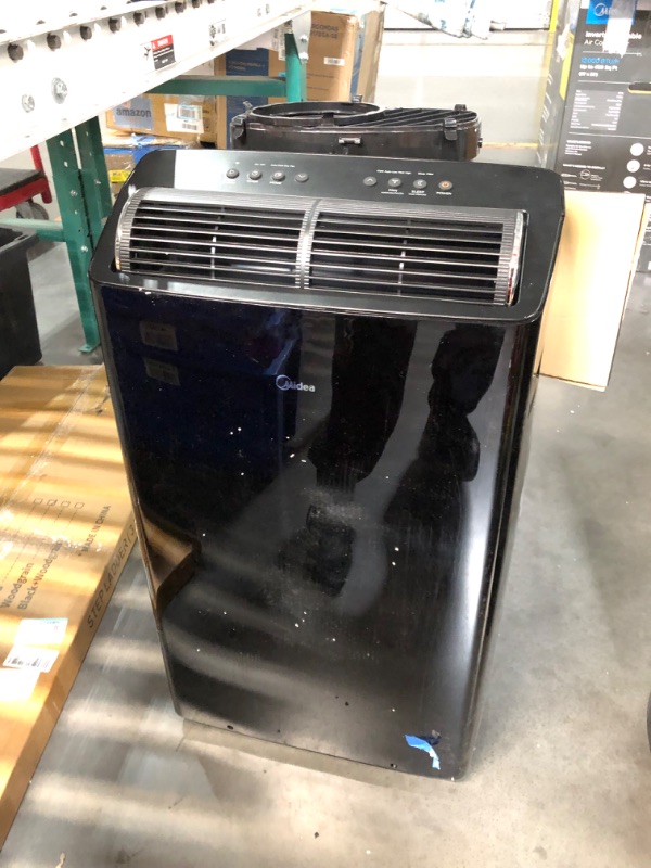 Photo 2 of ***USED - DAMAGED - SEE COMMENTS***
Midea Duo 12,000 BTU (10,000 BTU SACC) High Efficiency Inverter, Ultra Quiet Portable Air Conditioner, Cools up to 450 Sq. Ft., Works with Alexa/Google Assistant, Includes Remote Black 12,000 BTU