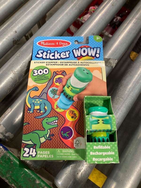 Photo 1 of Melissa & Doug Sticker Wow!™ 24-Page Activity Pad and Sticker Stamper, 300 Stickers, Arts and Crafts Fidget Toy Collectible Character – Dinosaur Creative Play Travel Toy for Girls and Boys 3+,