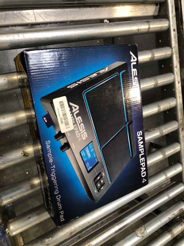 Photo 1 of Alesis Sample Pad 4 | Compact Percussion and Sample Triggering Instrument with 4 Velocity Sensitive Pads, 25 Drum Sounds and SD/SDHC Card Slot,Black