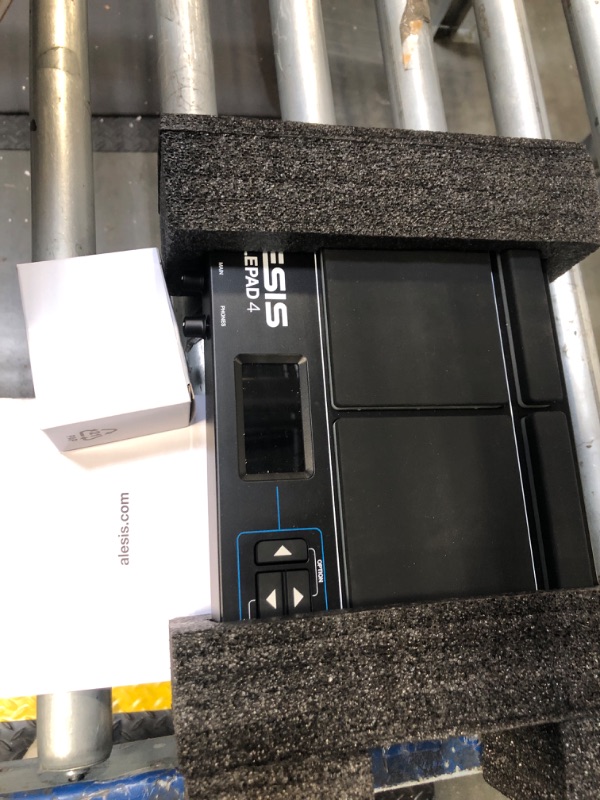 Photo 1 of Alesis Sample Pad 4 | Compact Percussion and Sample Triggering Instrument with 4 Velocity Sensitive Pads, 25 Drum Sounds and SD/SDHC Card Slot,Black