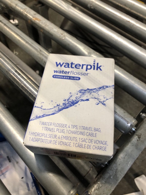 View 2 of Waterpik Cordless Slide Professional Water Flosser, Portable Collapsible for Travel and Storage, with Travel Bag and 4 Tips, ADA Accepted, Rechargeable and Waterproof, White WF-17CD010-1