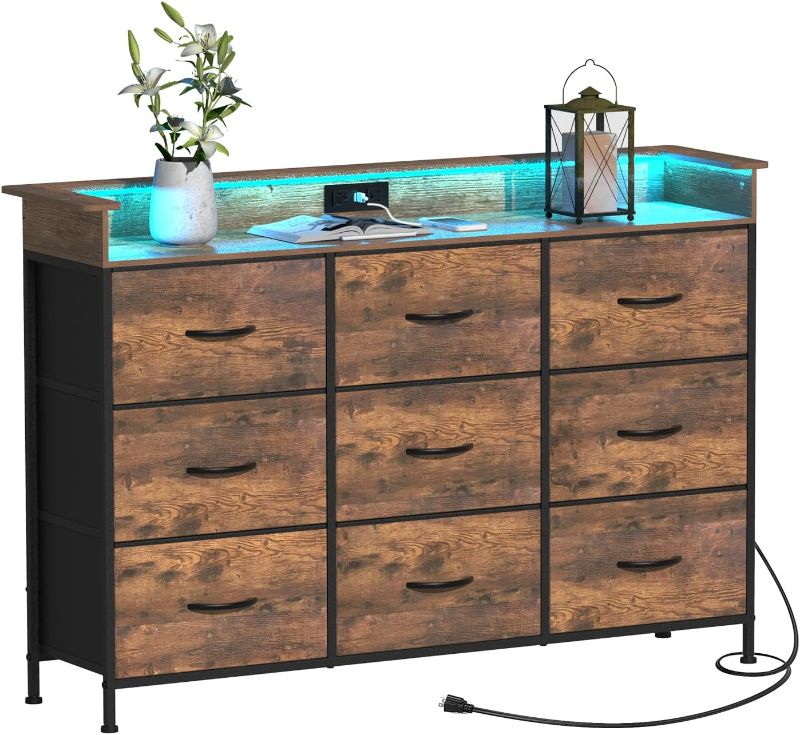 Photo 1 of Tv Stand Dresser for Bedroom with Charging Station and LED Lights,9 Fabric Drawers Black TV Stand with Open Shelf Storage,Media Console for TV ups to 55",Metal Frame,Wood Top,Black