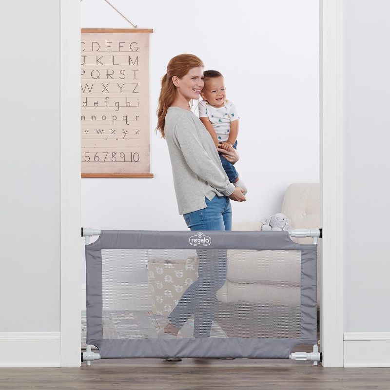 Photo 1 of Regalo 50" Extra Wide Gray Expandable Mesh Gate, Pressure Mounted, Includes Rubber Bumpers to Protect Walls
