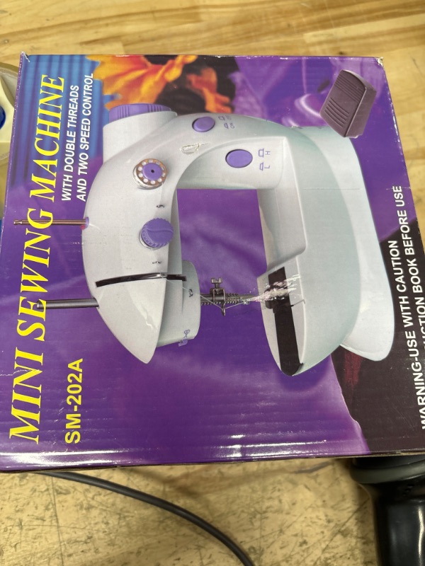 Photo 1 of Mini Sewing Machine,Portable Sewing Machine for Beginners Adult Kids, 2-Thread 2-Speed 2-Switches Electric Crafting Mending Machine Travel Automatic Sewing Machine