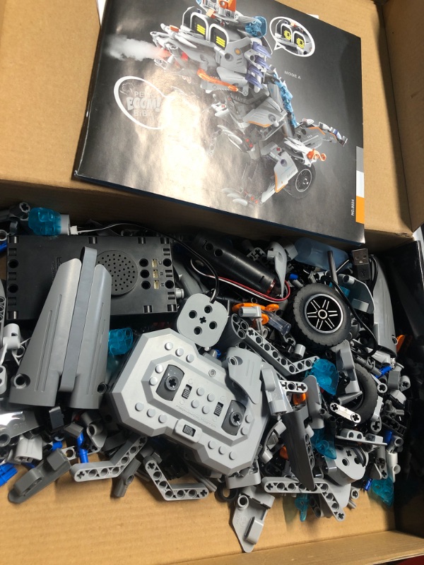 Photo 2 of **ALL PIECES ARE OUT OF PACKAGE AND LOOSE IN  BOX**
STEM Building Toys for Kids 6-14, Remote & APP Controlled 3in1 STEM Dinosaur Motorcycle Robot Building Kit for Kid with Music Spray, 646 Pcs Building Blocks Set Birthday Xmas Gift Ideas for Boys Girls