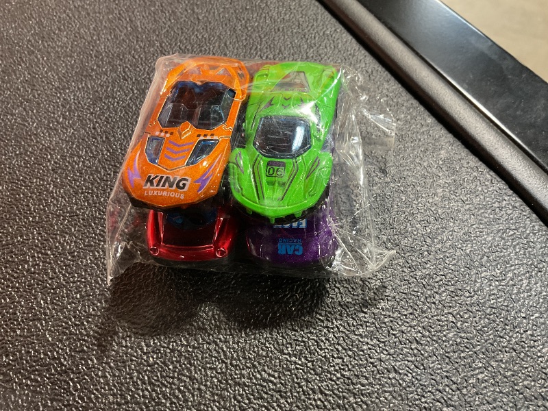 Photo 1 of 4 Pack of little toy cars.