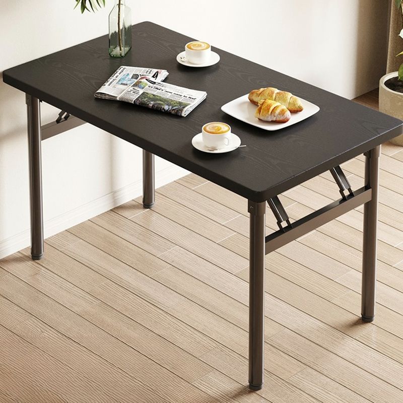 Photo 1 of ***Picture for reference only 
Folding Standard Height Table with Rectangular Black Wood Table Top