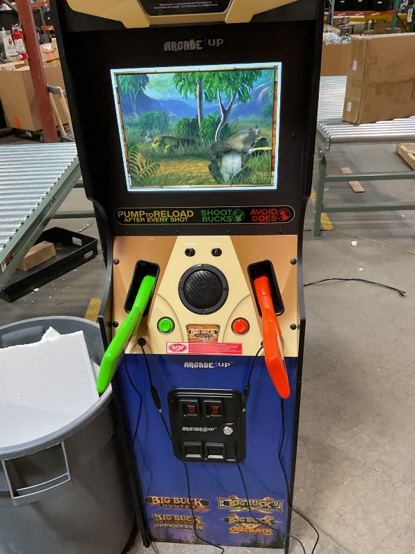 Photo 2 of Arcade1Up Big Buck Hunter Pro Deluxe Arcade Machine for Home, 5-Foot-Tall Stand-up Cabinet, 4 Classic Games, and 17-inch Screen this thing will turn on but something’s wrong with it. I can’t get it to play. I just cycles through the menu when you hit the 