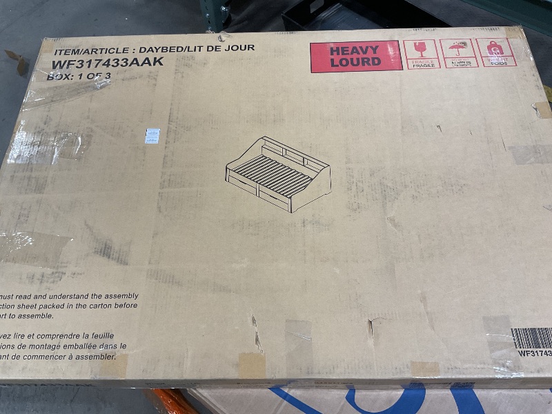 Photo 1 of This is box one of three. It is parts of what looks like a daybed. This is box one of three so only parts . All that was in the box were these two pieces of wood minor damage