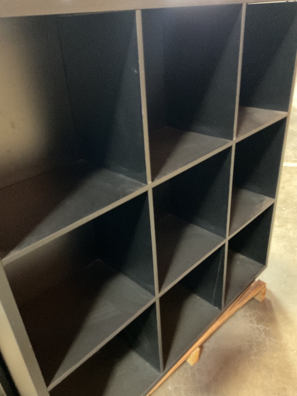 Photo 2 of Black 9-slot closed back shelf. 48” x 48” x 12”