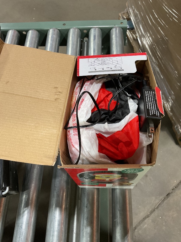 Photo 1 of Gemmy Christmas Airblown Inflatable Inflatable Minion Stuart Licking Candy Cane, 3.5 ft Tall, Yellow