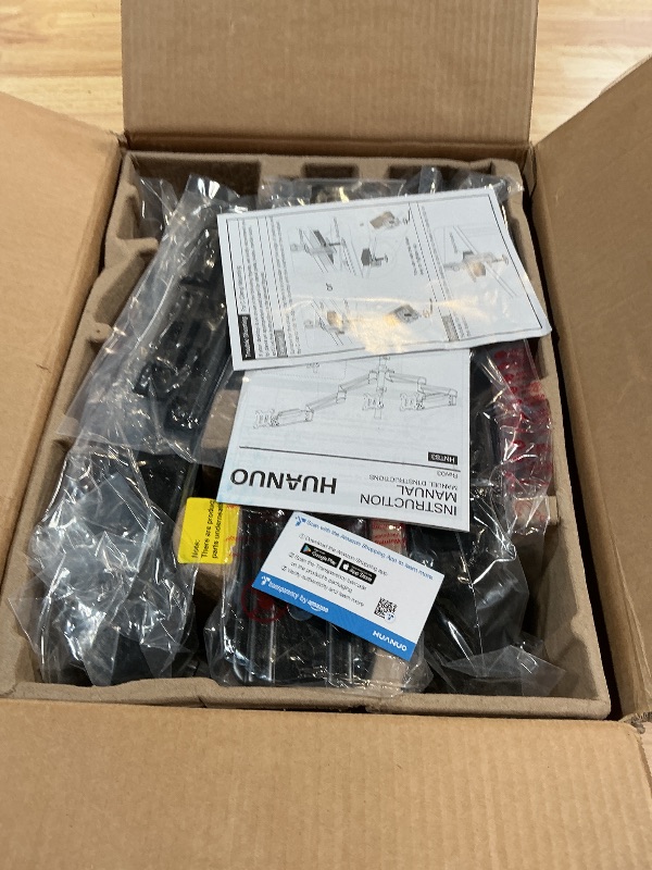 Photo 1 of ***POSSIBLY MISSING ORIGINAL ASSEMBLY PIECE (1 PIECE DOESNT MATCH OR IS DAMAGED) *** HUANUO Triple Monitor Mount for 17 to 32 inch Screens, Adjustment Gaming Triple Monitor Stand with Swivel, Tilt, Rotation, Clamp & Grommet Kit