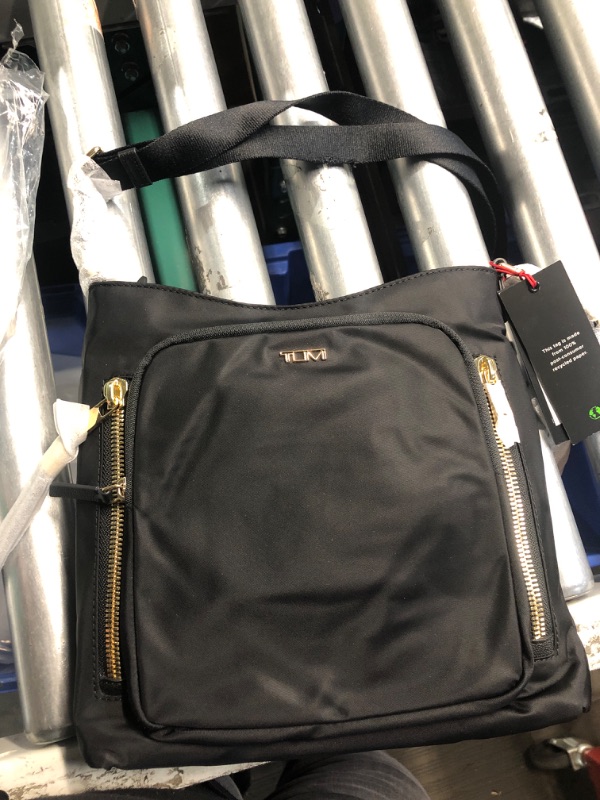 Photo 4 of **DAMAGED STRAP IS TORN ON THE EDGE**
TUMI - Voyageur Tyler Crossbody - Nylon Crossbody Bag - Business, Travel Bag - Stain, Water-Resistant - Stylish Purse - Black & Gold