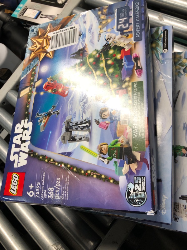 Photo 1 of LEGO Star Wars Advent Calendar 2024 for Kids - Christmas Advent Calendar W/ 18 Mini Builds & 5 Minifigures, Ages 6+ - Gift Idea for Boys & Girls - 75395