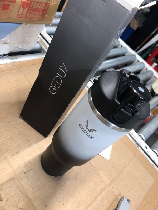 Photo 1 of **HANDLE BROKEN**

Gedux 40 oz Stainless Steel Tumbler with Handle and Straw, Vacuum Insulated Water Bottle with 2-in-1 Lid (Chug Lid/Straw Lid) and Silicone Boot (Day & Night, 40oz)