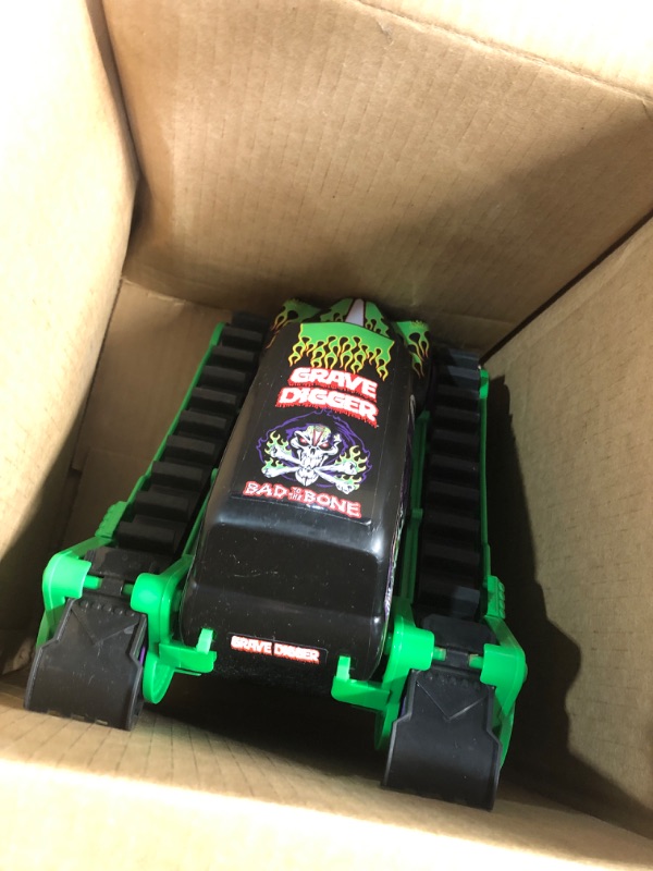 Photo 2 of ***(PARTS ONLY/ NON FUNCTIONAL/ NO RETURNS OR REFUNDS) ***
Monster Jam, Official Grave Digger Trax All-Terrain Remote Control Outdoor Vehicle, 1:15 Scale, Kids Toys for Boys and Girls Ages 4 and up