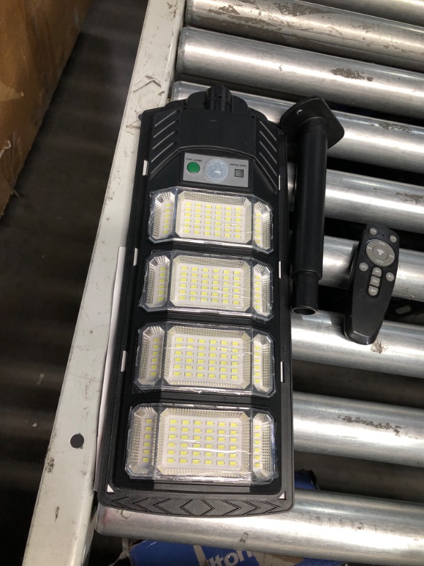 Photo 3 of ***USED - LIKELY MISSING PARTS - UNABLE TO VERIFY FUNCTIONALITY***
2 Pack Solar Street Lights Outdoor Waterproof 6500K 12000LM 5730SMD LEDs Solar Flood Lights Dusk to Dawn Solar Parking Lot Light Wide Motion Sensor and Remote Control for Area Lighting Yar