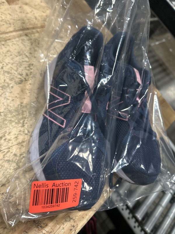 Photo 1 of "New balance size 11 navy blue womens walking shoe"
