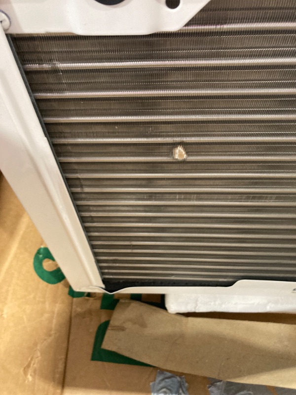 Photo 6 of ***damage shown in multiple pictures*** ***loose parts in box*** LG 18,000 BTU Window Air Conditioner with Heat, 230/208V, Cools 1,000 Sq.Ft. for Bedroom, Living Room, Basement, Apartment, with Remote, 2 Speeds, 24-Hour Timer, White Bright White 18000 BTU